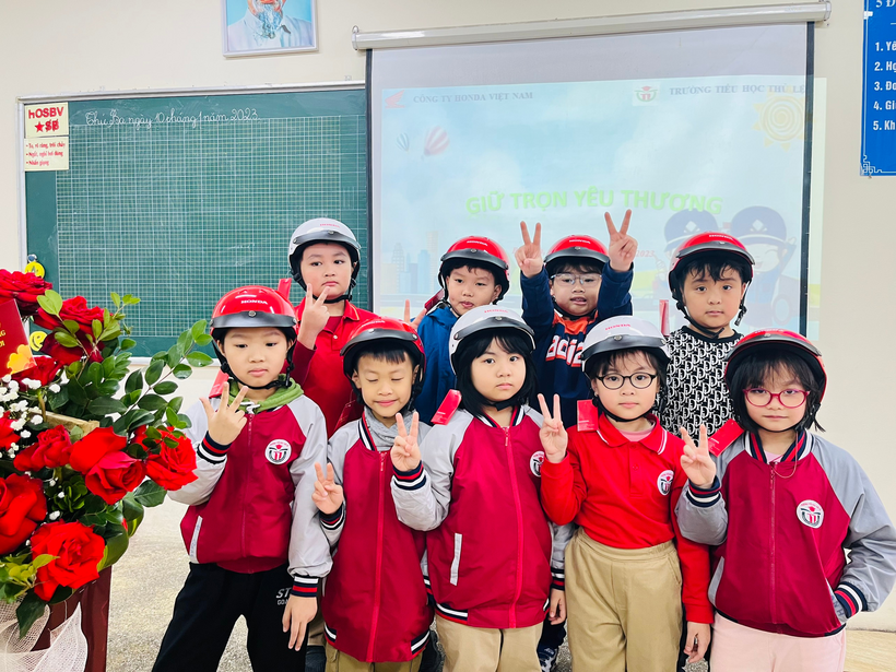A group of children in red and white uniforms posing for a photo

Description automatically generated with low confidence