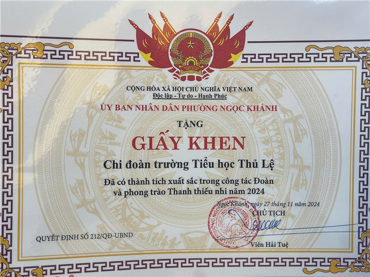 A certificate with red and gold text

Description automatically generated