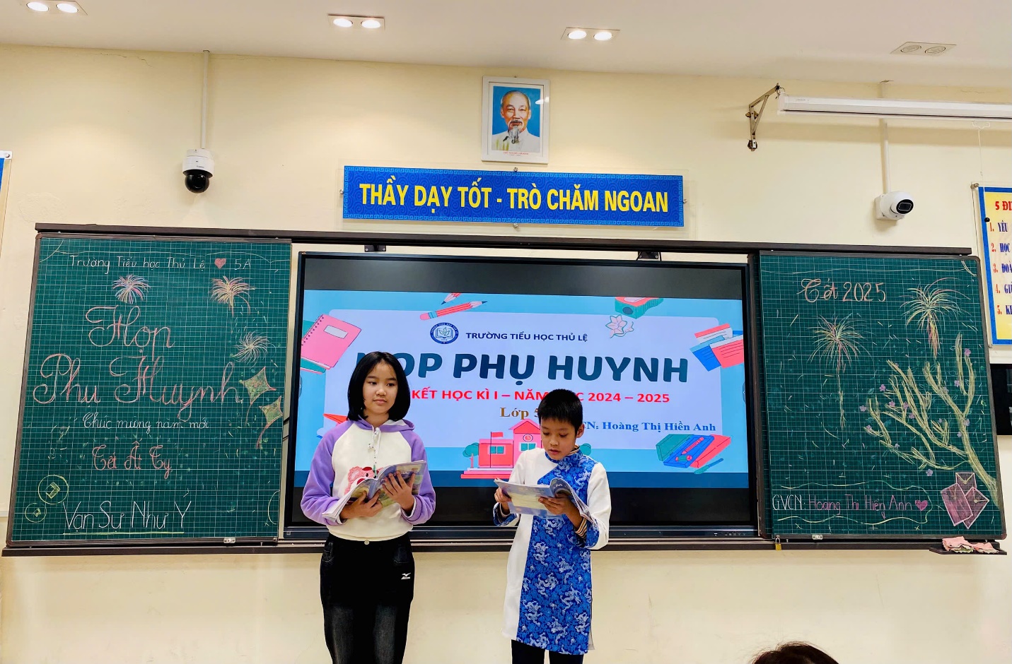 A person and child standing in front of a large screen

Description automatically generated