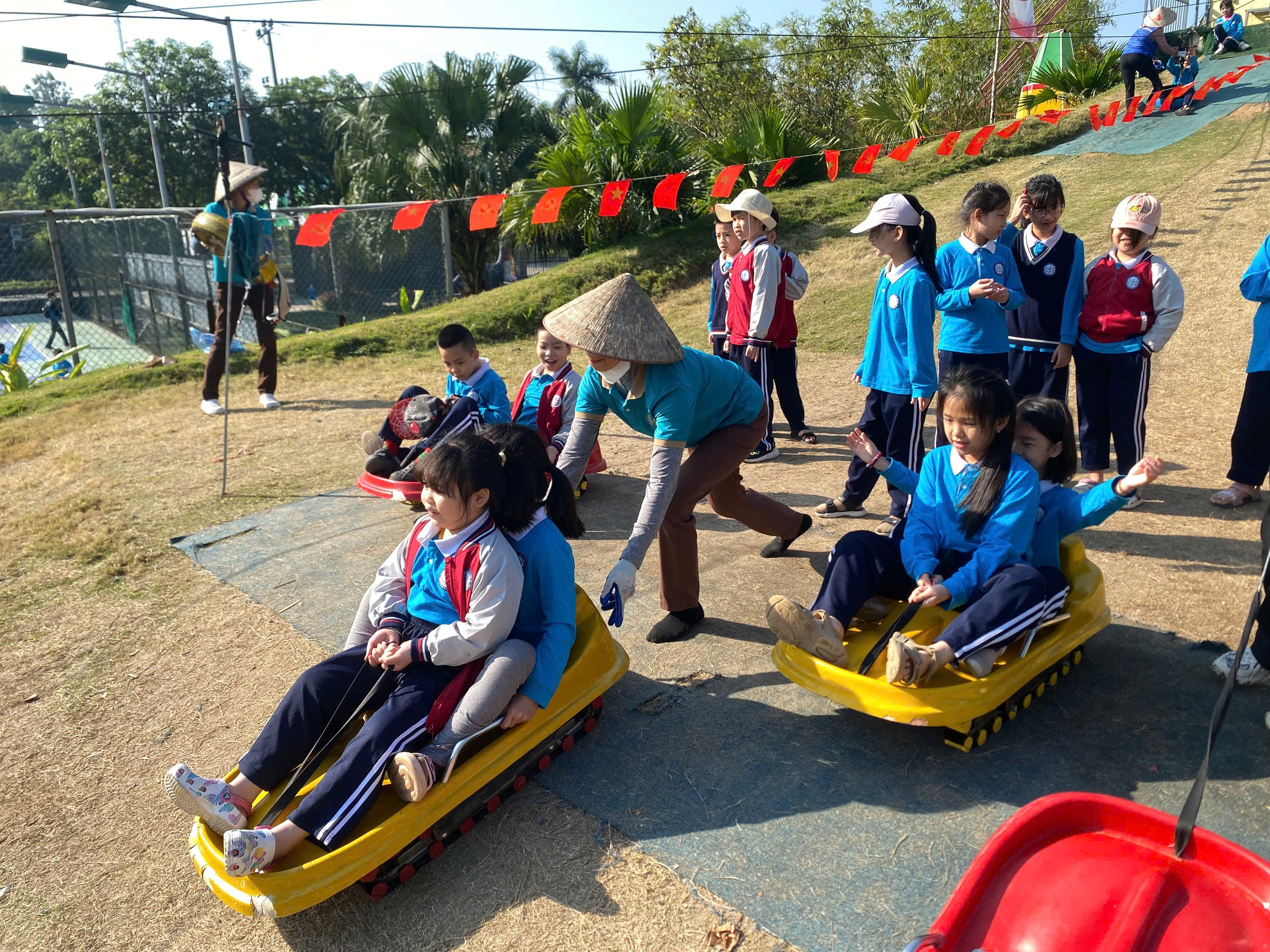 A group of children riding in small sleds
AI-generated content may be incorrect.
