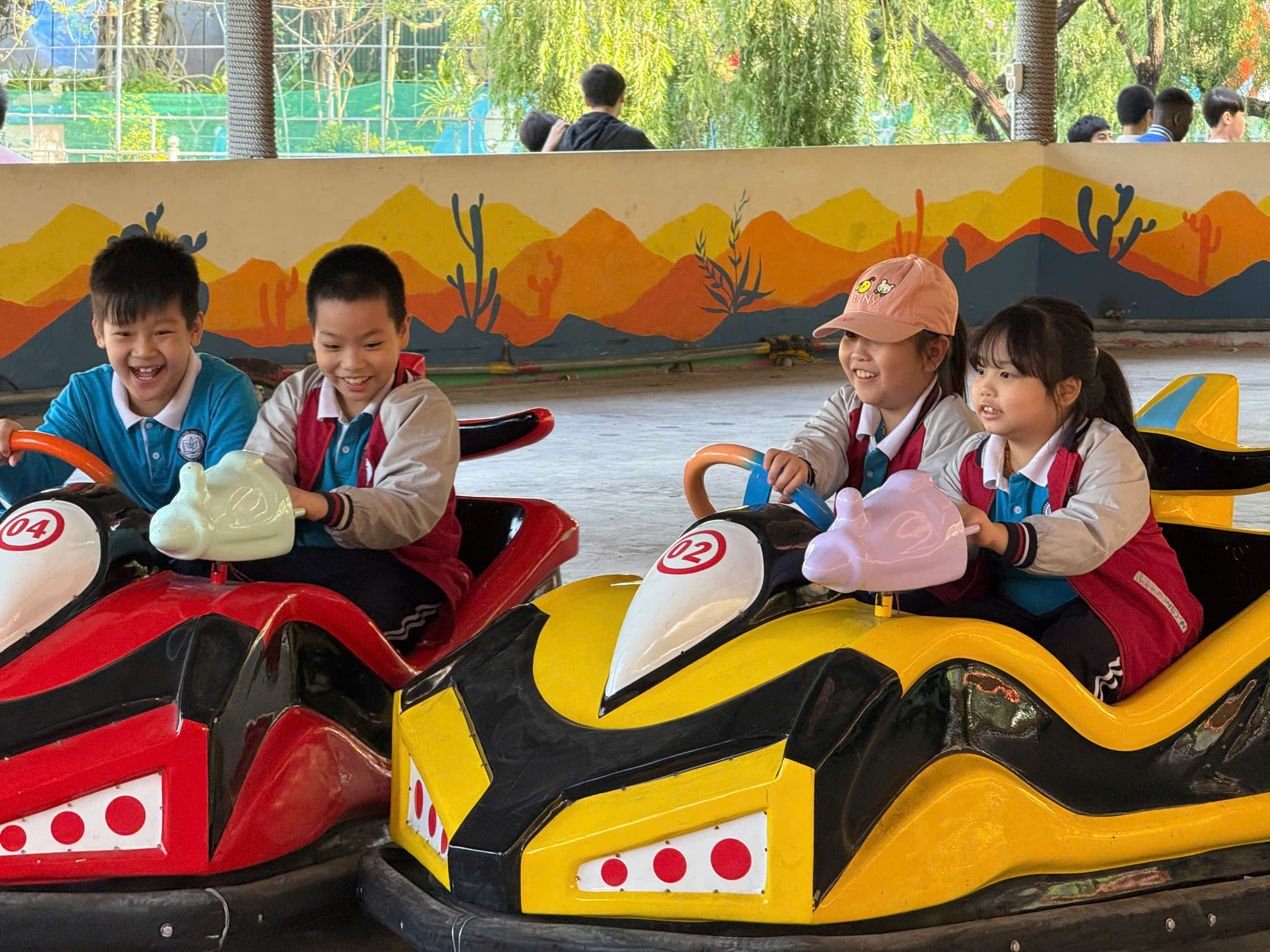 A group of children riding bumper cars
AI-generated content may be incorrect.
