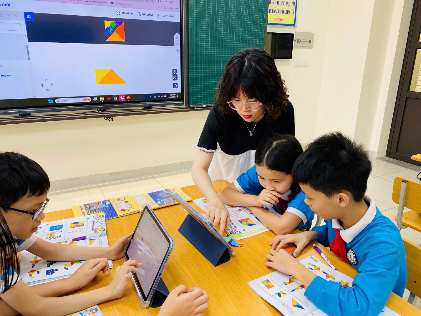 A group of children sitting around a table with a person looking at a tablet

AI-generated content may be incorrect.