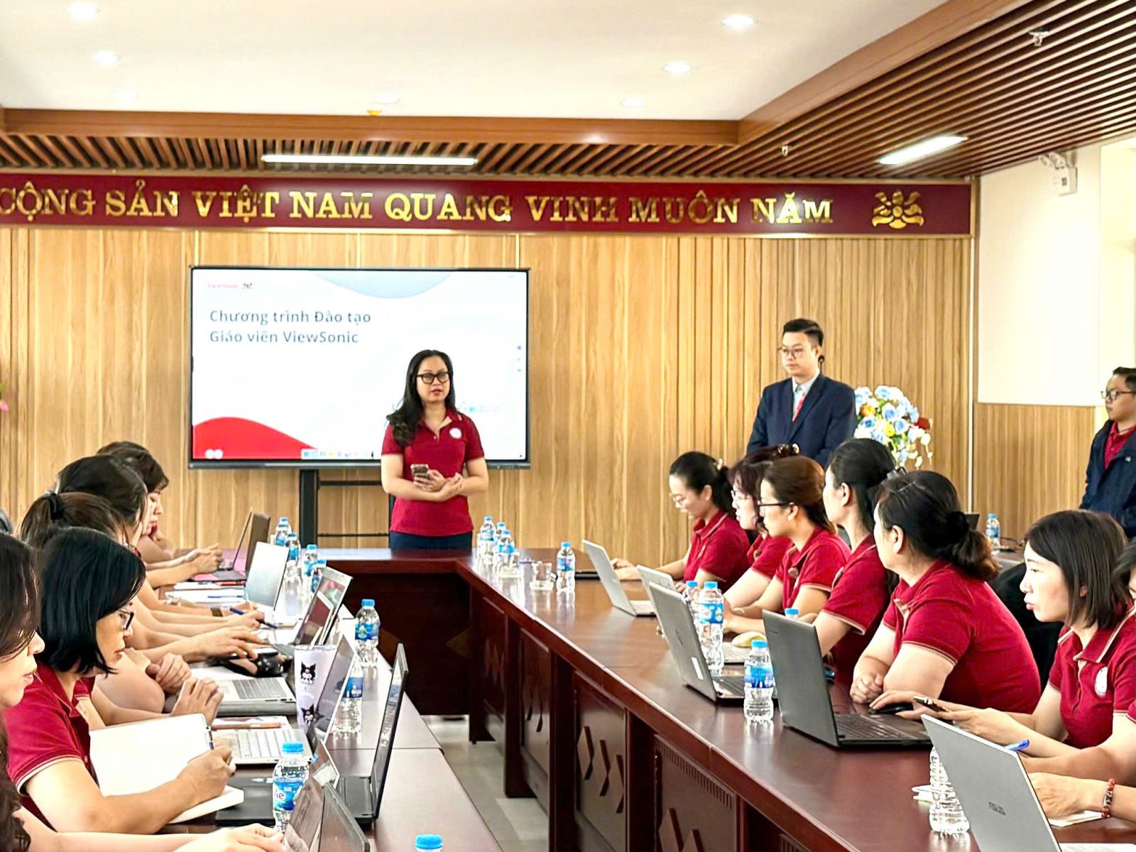 A person and person standing in front of a group of people

AI-generated content may be incorrect.