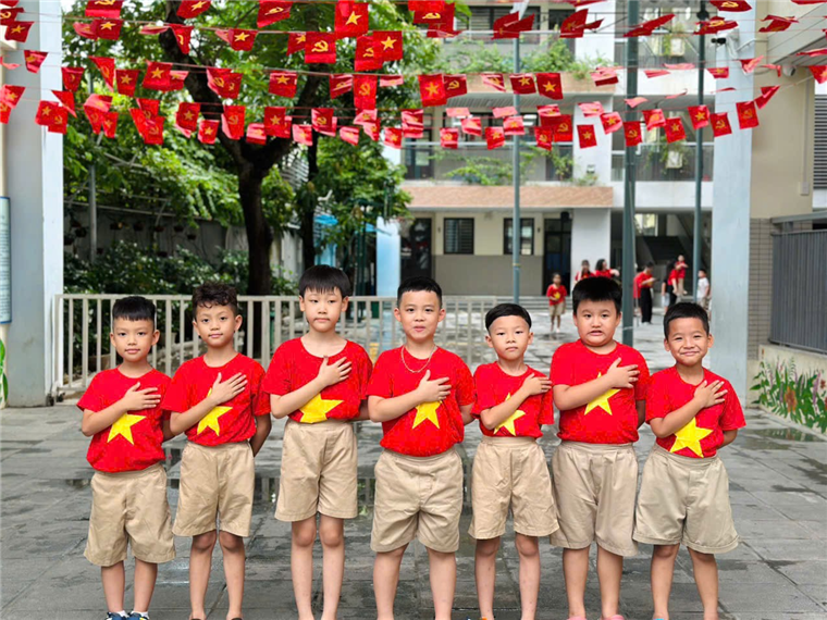A group of boys wearing red shirts
AI-generated content may be incorrect.