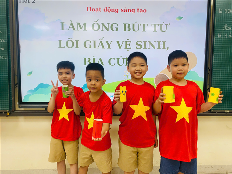A group of boys in red shirts holding paper cups
AI-generated content may be incorrect.