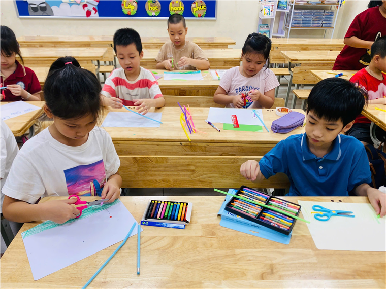 A group of children drawing at desks
AI-generated content may be incorrect.