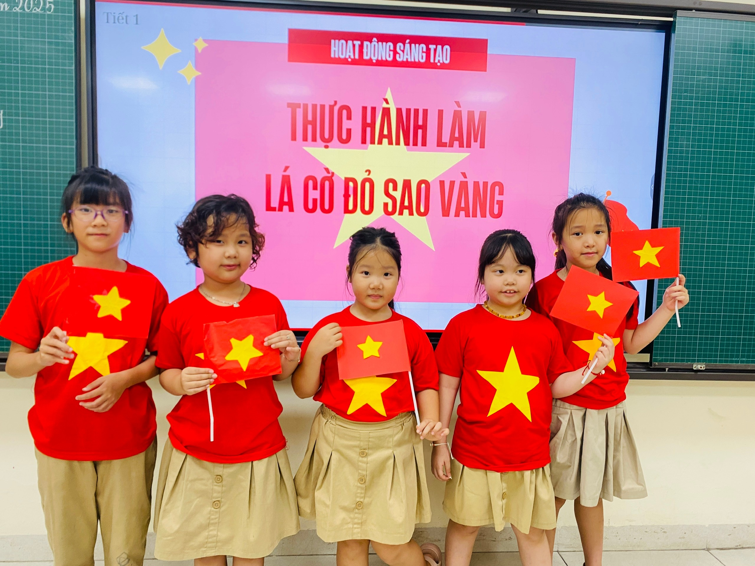 A group of young girls holding red flags
AI-generated content may be incorrect.