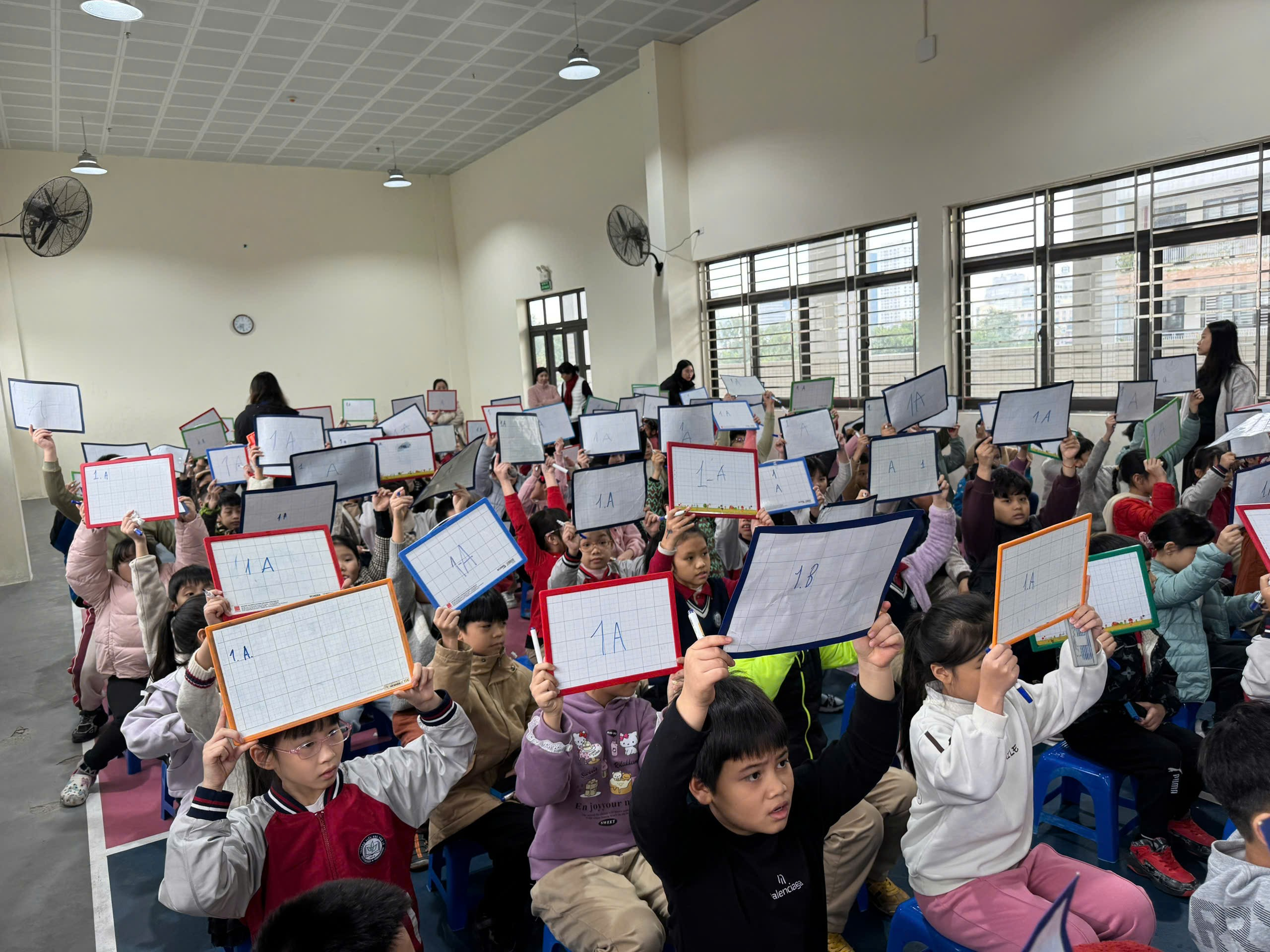 A group of children holding up papers
AI-generated content may be incorrect.