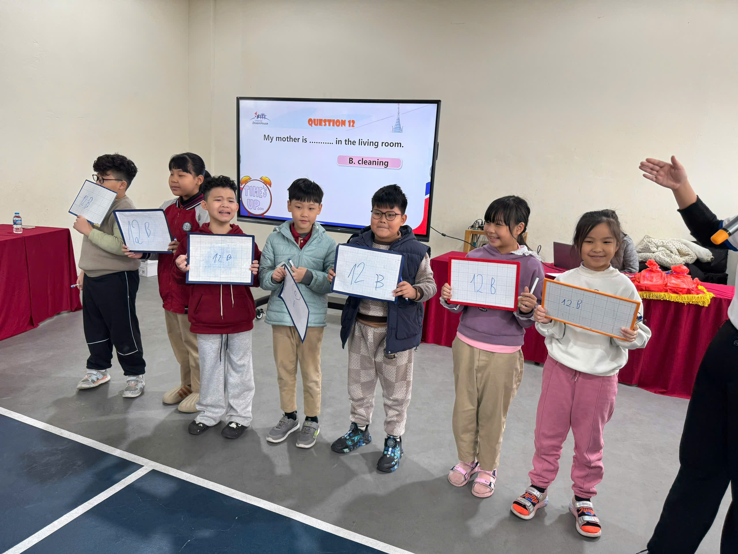 A group of children holding whiteboards
AI-generated content may be incorrect.