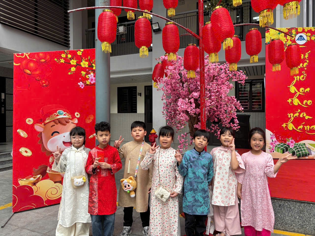 A group of children standing in front of a red and white sign

AI-generated content may be incorrect.